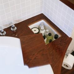 a bathroom with a sink, toilet and bathtub in the corner next to each other