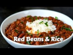 red beans and rice in a white bowl with the words red beans and rice above it