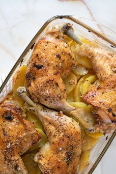 chicken and potatoes in a glass casserole dish