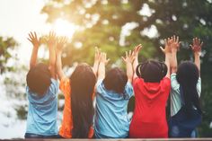 children raising their hands in the air with text reading online shopping kids australia on it