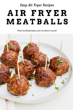 air fryer meatballs on a white plate with toothpicks in the middle