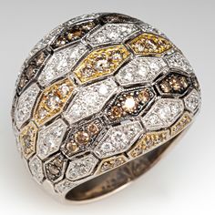 This substantial Sonia B. ring features a domed pierced design and is accented with sixty-eight (68), bead set, round brilliant cut diamonds and fifty-nine (59), bead set, round brilliant cut champagne colored diamonds. The ring measures 21.6mm at the top, rises 8.5mm above the finger, tapering to 6.8mm wide and 1.6mm thick at the base of the shank. The ring is size 8 and resizing is not recommended. Antique Cocktail Ring, White Champagne, Vintage Jewlery, Yellow Diamonds, Diamond Cocktail Ring, Wide Band Ring, Jewelry Brands, Stones Jewelry, Diamond Cocktail Rings