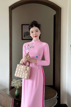 Vietnamese Ao Dai with sharp 3D printed motifs on silk fabric. Slim and lightweight design enhances the female figure. High quality silk material, slight stretch, very light and comfortable to wear. Elegant Pink Ao Dai With Floral Embroidery, Full Length Floral Embroidered Dress, Elegant Ao Dai With Floral Embroidery For Spring, Pink Fitted Long Ao Dai, Long Fitted Pink Ao Dai, Elegant Full Length Ao Dai For Spring, Traditional Pink Ao Dai For Spring, Fitted Ao Dai With Floral Print For Spring, Fitted Pink Ao Dai For Spring