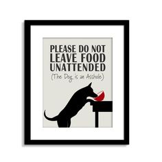 a black framed poster with a cat eating out of a red bowl that says please do not leave food unattended