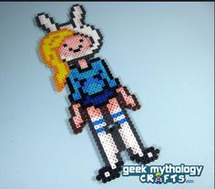 an image of a pixel character made out of beads