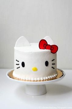 a hello kitty cake on a white plate