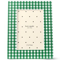 a green and white checkered frame with polka dots