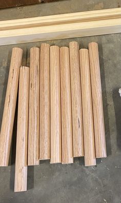 several pieces of wood sitting on top of a floor next to a piece of plywood