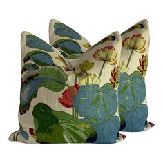 two pillows with flowers and leaves on them