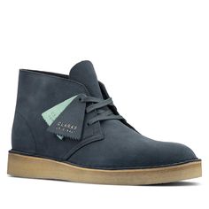 A Unique Interpretation Of The Clarks Iconic Desert Boot The Simple Yet Stylish Desert Coal Is Back Again For This Season This Time In Classic Blue Suede And Crafted From European Materials. Casual Ankle Boots With Branded Heel, Blue Round Toe Workwear Boots, Blue Workwear Boots With Round Toe, Casual Blue Boots For Workwear, Casual Blue Workwear Boots, Blue Leather Low-top Boots, Blue Low-top Leather Boots, Men's Clarks, Desert Boot