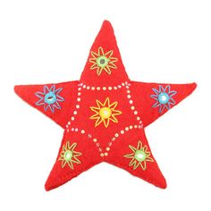 a red felt star ornament with jewels on it