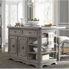 an old style kitchen island with drawers and cupboards