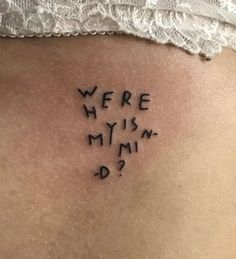 the back of a woman's stomach with words written in cursive writing