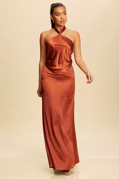 Indulge in effortless elegance with our Graceful Tie Halter Maxi Dress. Crafted from luxurious fabrics, this dress features a flattering tie halter neckline and a flowy maxi silhouette. Perfect for any special occasion, this dress will make you feel like a true fashion icon. Self: 98%Polyester 5%Spandex Lining: 100%Polyester