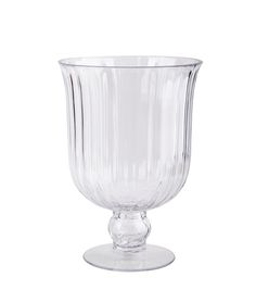 a clear glass vase sitting on top of a table