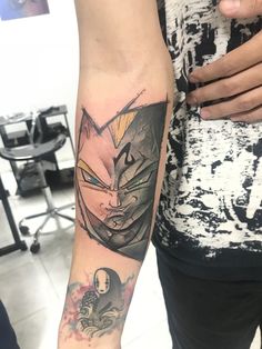 a person with a tattoo on their arm and the image of an angry cat behind them