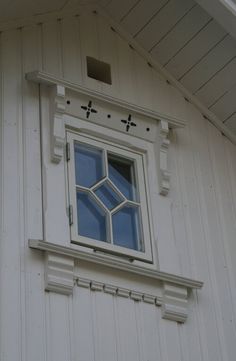 a white building with a window on the side