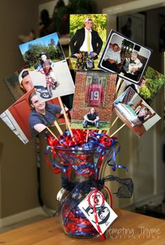 a vase filled with pictures and stickers on top of a table