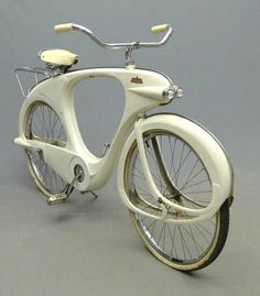 an old fashioned bicycle is shown on a gray background with white trim and spokes