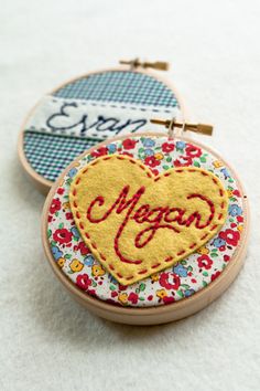 two embroidered hoops with the word vegan written in red, yellow and blue