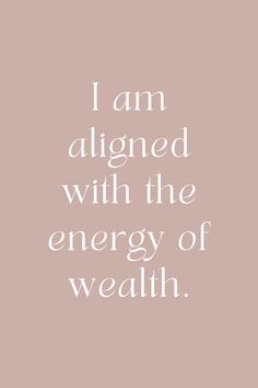 a quote that says i am aligned with the energy of wealth on it's pink background