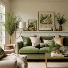 a living room filled with lots of furniture and plants on top of the couches