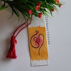 a bookmark with an image of a woman's face on it and flowers in the background