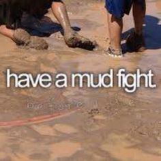 children playing in mud and water at the beach