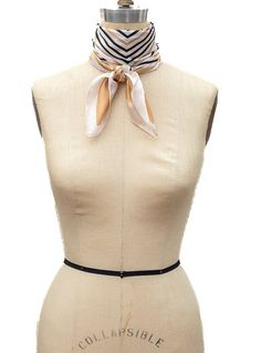 Our Ivory Black Gold Geometric Print Silky Neck Scarf can make any outfit stylish Geometric print on a silky feel fabric Colors: Ivory/Black/Gold Fabric content: 100% Polyester Dimensions: 28" x 28" Can be worn many different ways Chic Cream Scarves For Spring, Chic Cream Scarf For Spring, Chic Cream Silk Scarf For Spring, Chic White Silk Scarf For Work, Chic White Silk Scarf For Workwear, Chic Beige Silk Scarf, Elegant Beige Scarves For Workwear, Formal Beige Silk Scarf For Spring, White Satin Silk Scarf Chic Style