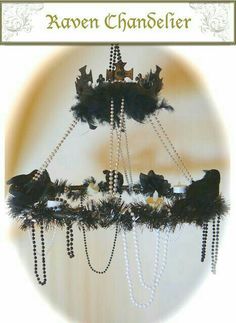 an image of a chandelier that is decorated with feathers and beads on it