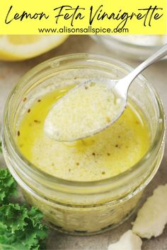 lemon feta vinnegrete in a jar with a spoon