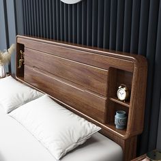 a wooden headboard with white pillows and a clock on the wall