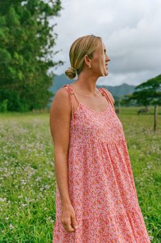 Introducing the Millie Dress, in a fun new print that is super happy and reminds us of Kauai. With tie straps, a beautiful and vibrant pink floral, and a textured fabric, you'll feel elegant and relaxed all day long. The modest neckline and perfect length add the finishing touch to this playful and stylish dress. Bethany Hamilton x CJLA Collection FIT Made in LA Easy, Flowy Fit Adjustable Tie Straps Nursing Friendly Not Stretchy, Size Up for Larger Bust Not Lined Bethany is 5'11 Wearing Size Lar Pink Dress With Tie Straps, Pink Printed Sundress With Spaghetti Straps, Pink Dress With Adjustable Straps For Garden Party, Pink Dresses With Adjustable Straps For Garden Party, Pink Floral Sundress With Spaghetti Straps, Pink Feminine Floral Dress With Spaghetti Straps, Pink Floral Dress With Spaghetti Straps For Brunch, Pink Dress With Adjustable Straps For Day Out, Pink Dresses With Adjustable Straps For Day Out