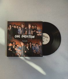 the one direction tour album is on display