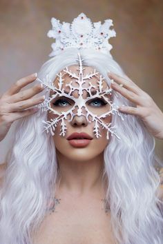 A very detailed cut-out mask of a snowflake. Made of lightweight vegetable-tanned leather, wet formed and painted any color you choose.  Weighing in at 1/5 of an ounce (6 gm), this lovely mask can be worn all day in comfort. Comes with an adjustable double strand of elastic. Reviews for the Snowflake mask: SO AMAZING Great quality!! Comfortable!! Beautiful And I ordered it on Monday - asked for it by Friday - and got it PERFECT transaction - will buy from again--Amy Wonderful mask!! Really kool. Woman Snowman Costume, Woman Masquerade Mask Winter Dress, White Snow Mask, Snowflake Costume Tutu, Snow Queen Adult Costume, Snow Queen Gifts, Xmas Mask, Winter Masquerade, Mask Venetian