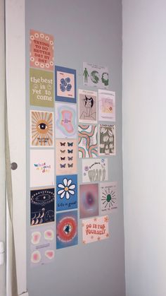 the wall is covered with many different types of stickers and magnets on it