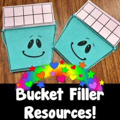 a bucket filled with hearts and stars next to the words bucket filler resources on a wooden table