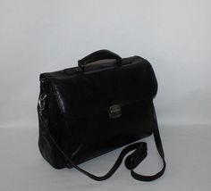 Black Leather MIGANT Hand Bag Business Office A4 Document Portfilio Briefcase Please check measurements  Height - 13.25  inches ( 33.6 cm)  Width - 17 inches (43.2 cm  )  Bottom  - 16.25 x 4.5  inches (41.2 cm x 11.6 cm )  Handle - 9 inches (22.8 cm )   Strap - 53 inches ( 134.7 cm )   The Handbag is good condition , please see all pic.  Please pay attention pic. 9.10 *Please note that most of my items are vintage and has therefore been previously used unless stated otherwise. Vintage items will have some degree of wear, bobbling or a musty smell. Please take this into consideration when purchasing. If the item has any defects these will be stated in the listing and I do my very best to describe items as honestly as I can.I'm unable to wash the items so they will need a run through the was Professional Black Rectangular Case, Black Rectangular Satchel For Business Trips, Classic Black Rectangular Laptop Bag, Black Rectangular Laptop Bag For Formal Use, Black Rectangular Laptop Bag For Formal Occasions, Formal Black Rectangular Laptop Bag, Professional Black Briefcase For Office, Professional Black Laptop Bag, Black Rectangular Professional Bag