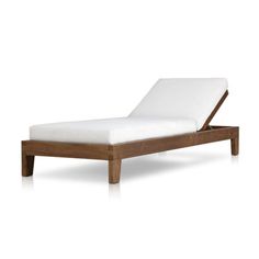 an outdoor chaise lounge chair with white cushions and wood frame, viewed from the side