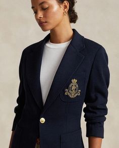 This modern blazer stands out with embellishing details while maintaining timeless style. Featuring a notched lapel, button front closure and long sleeves with buttoned cuffs, it offers versatile layering. An embroidered crest at the chest pocket along with hip and chest patch pockets add fashion-forward flair. Lined in luxurious fabrics, this piece moves effortlessly from day to night. Crafted from a soft blend, it feels as polished as it looks. With its back vent and adaptability for all occas Ralph Lauren Outerwear With Welt Pockets For Work, Ralph Lauren Single-breasted Long Sleeve Blazer, Ralph Lauren Long Sleeve Blazer, Designer Long Sleeve Blazer With Pockets, Ralph Lauren Luxury Long Sleeve Blazer, Ralph Lauren Outerwear With Lapel Collar And Welt Pockets, Ralph Lauren Outerwear With Welt Pockets And Lapel Collar, Designer Long Sleeve Blazer With Welt Pockets, Luxury Ralph Lauren Blazer For Work