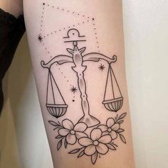 a lady justice tattoo on the arm