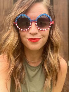 Rock out to Party in the USA with these fun patriotic sunglasses. Perfect for the 4th of July! These are adult size. Festival Sunglasses With Uv Protection, Festival Sunglasses With Uv Protection And Plastic Frames, Playful Tinted Lens Sunglasses For Festival, Summer Music Festival Plastic Sunglasses, Fun Summer Sunglasses With Glass Lenses, Fun Beach Sunglasses With Glass Lenses, Novelty Sunglasses For Summer, Festival Fun Sunglasses With Mirrored Lenses, Fun Summer Sunglasses For Music Festivals