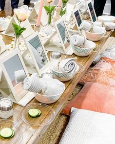 a table topped with lots of pictures and candles