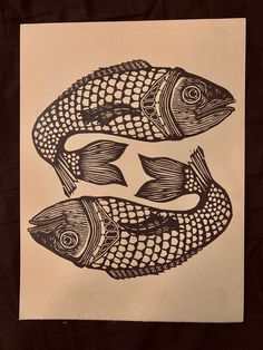 three fish are depicted in this black and white drawing