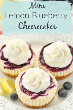 three mini lemon blueberry cheesecakes on a white plate