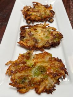 three fried food items on a white plate