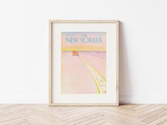 the new yorker magazine cover framed in a wooden frame on a wall next to a herringbone floor