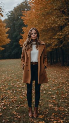 Stylish woman wearing a tan coat and boots in a fall setting, surrounded by autumn leaves. Southern Charm Outfits Fall, Outfits For Visiting Family, Pedicure Outfit Fall, Autumn Attire For Women, Fall Causal Outfit, Cosy Casual Outfits, 2024fall Fashion Trends, Autumn Outfits 2024 Trends Casual, Autumn Tone Outfits