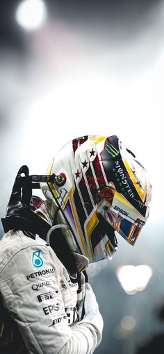 a man in a racing suit and helmet