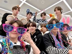 a group of young men wearing sunglasses and bunny ears